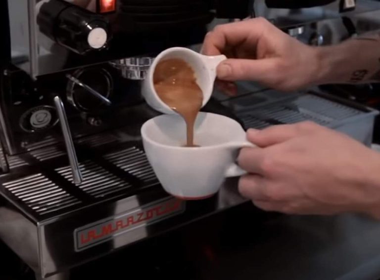 preparing an espresso drink - espresso Long Black