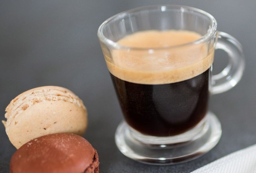 espresso shot in glass cup and macarons