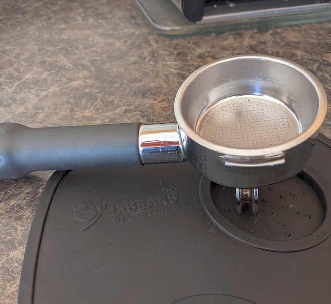 portafilter on a tamping mat