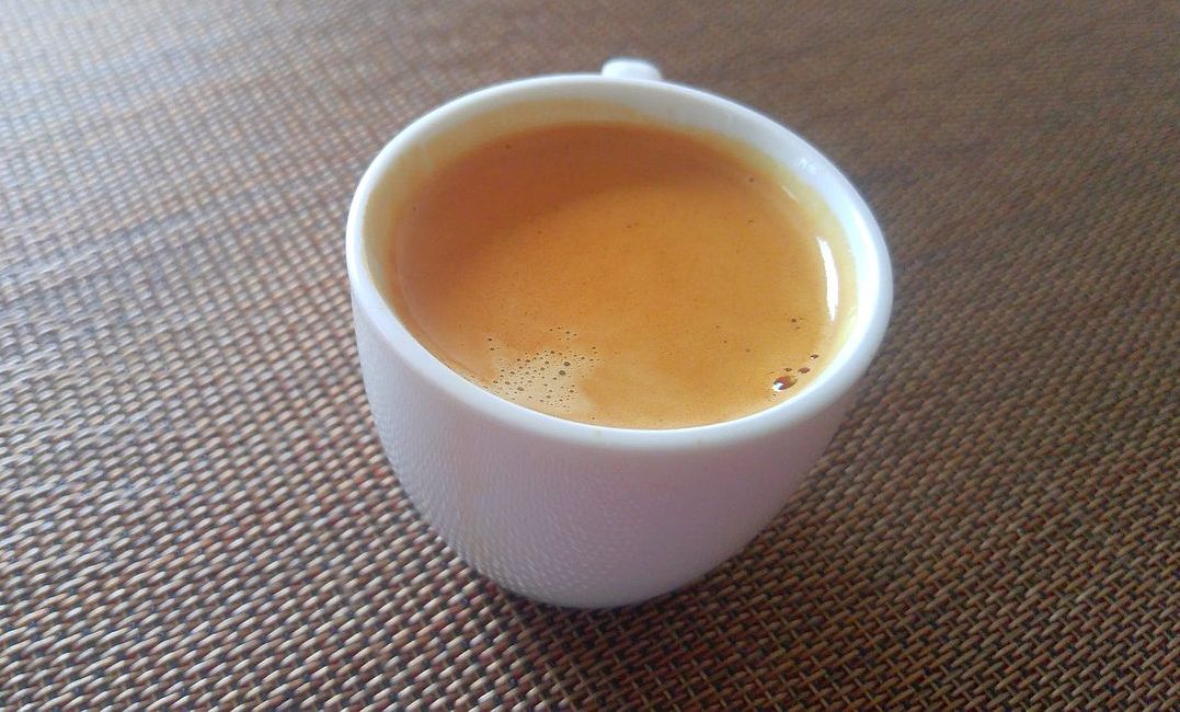 espresso shot in white demitasse