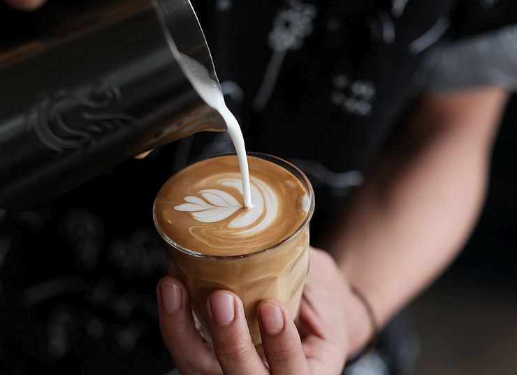 pouring a flat white with latte art