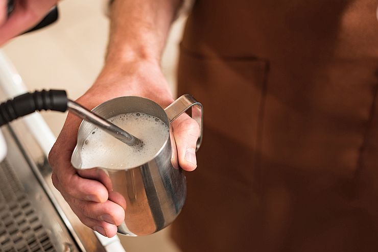 steaming milk for cappuccino with a steaming wand