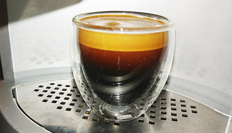 freshly pulled espresso shot in glass cup