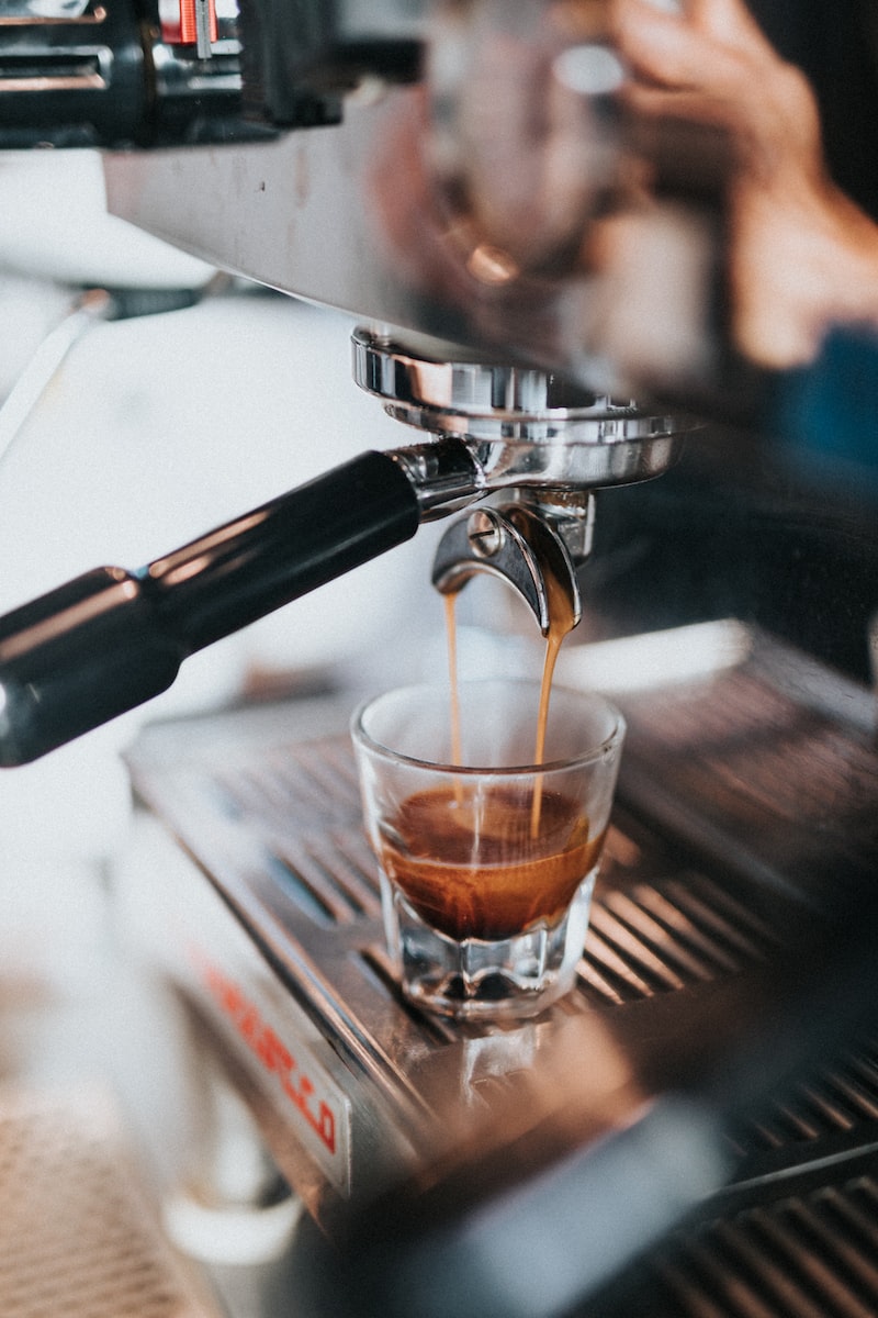 Pulling an espresso shot in a glass